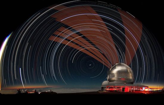White and brown streams of light are seen in front of a night sky. To the right is a white domed building.